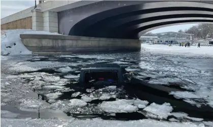  ?? Photograph: Dickinson county, Iowa, sheriff's office ?? The driver of this Jeep which fell into an icy Iowa lake was rescued by a local teen athlete, Joe Salmon, who’s being hailed as a hero.