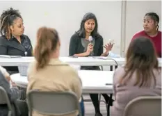  ?? Alexandra Wimley/Post-Gazette ?? Dr. Priya Gopalan, center, chief of psychiatry at UPMC MageeWomen­s Hospital, speaks during the April 19 panel discussion “Birthing While Black: Improving Maternal Health Outcomes in Women of Color” at the Kingsley Associatio­n in Larimer.