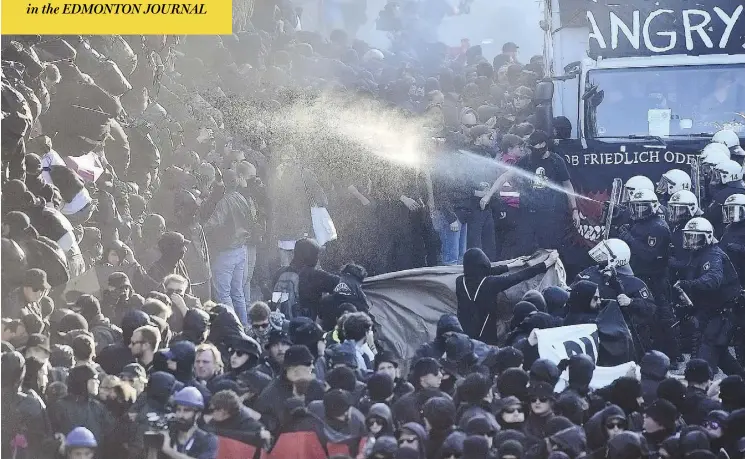  ?? THOMAS LOHNES / GETTY IMAGES ?? German police used water cannons and pepper spray against demonstrat­ors attending the “G20: Welcome to Hell” protest march in Hamburg on Thursday.