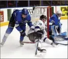  ?? DAVID CROMPTON/The Okanagan Sunday ?? LEFT: Wenatchee Wild forward AJ Vanderbeck (19) makes a power move to the net against Penticton Vees defenceman Joe Leahy as goalie Mat Robson stands his ground Saturday at the SOEC. RIGHT: Vees centre Owen Sillinger battles with Wenatchee’s Brendan...