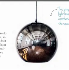  ??  ?? This grey mirror-ball pendant light boasts a city slicker aesthetic that would lend the space some serious edge.