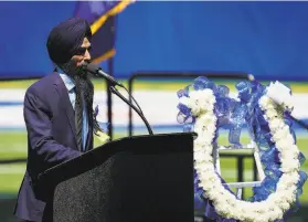  ?? Grace Hollars / Indianapol­is Star ?? Gurvinder Singh speaks during a gathering at Lucas Oil Stadium to honor the eight people killed last month in the FedEx facility shootings in Indianapol­is.