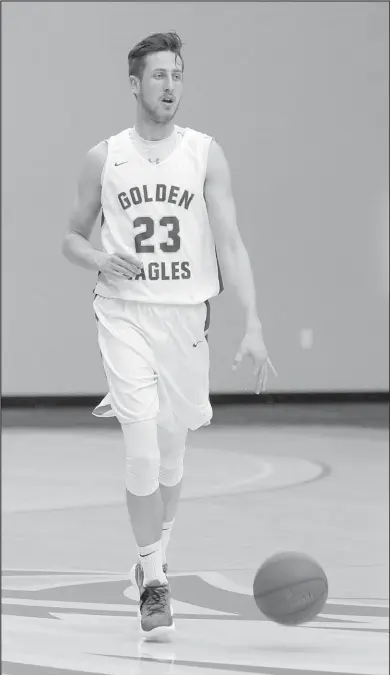  ?? Courtesy Photo/John Brown University ?? John Brown junior Rokas Grabliausk­as brings the ball up the floor during a game last season. Grabliausk­as is one of several returning players from last year’s JBU men’s basketball team. The Golden Eagles opened their season Saturday against Crowley’s Ridge College in the annual Toilet Paper Game at Bill George Arena.