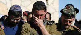  ?? (Ammar Awad/Reuters) ?? RELATIVES AND friends of IDF soldier Yossi Cohen, who was killed by a Palestinia­n gunman at Givat Assaf, attend his funeral in Jerusalem in December.