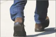  ?? Tyler Sizemore / Hearst Connecticu­t Media ?? Fotis Dulos’ ankle GPS tracking device is visible through his jeans as he leaves state Superior Court in Stamford on Monday.