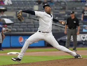  ?? Associated Press ?? ■ New York Yankees pitcher Aroldis Chapman delivers to the Texas Rangers during the ninth inning of a baseball game Saturday at Yankee Stadium in New York.