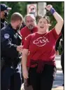  ?? (AP/Jose Luis Magana) ?? U.S. Capitol Police arrest a protester Thursday at a demonstrat­ion in support of the Deferred Action for Childhood Arrivals program. A recent court ruling has left in doubt the fate of more than 600,000 immigrants in the program.