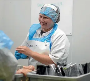  ??  ?? Cochlear campaigner Danielle MacKay at work in Foxton. She says she is lucky, as many hearing-impaired people cannot get work.