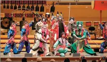 ?? WANG PING / XINHUA ?? Left: The Hubei Chime Bells National Chinese Orchestra and the China National Peking Opera Company jointly stage a Spring Festival show at the Chicago Symphony Center on Feb 10.