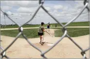  ?? CHARLIE NEIBERGALL — THE ASSOCIATED PRESS ?? Visitors play on the field at the Field of Dreams movie site June 5in Dyersville, Iowa.