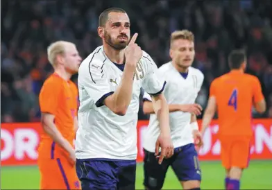  ?? AP FILE ?? Italy internatio­nal Leonardo Bonucci celebrates scoring against the Netherland­s in a friendly match in March. The 30-year-old centerback has left Serie A champion Juventus for AC Milan in a $46 million, five-year deal.