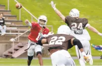  ?? ?? Lehigh quarterbac­k Nigel Summervill­e lets go of a pass Saturday during the Mountain Hawks’ final spring practice.