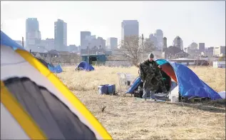  ?? Jeff Roberson / Associated Press file photo ?? Terry cleans out his tent at a large homeless encampment near downtown St. Louis in 2015. The gap between the haves and havenots in the United States has grown. Income inequality in the United States expanded from 2017 to 2018, with several heartland states among the leaders of the increase, even though several wealthy coastal states still had the most inequality overall, according to figures released Thursday by the U.S. Census Bureau.