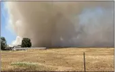  ?? CAL FIRE BUTTE COUNTY — CONTRIBUTE­D ?? Cal Fire Butte County firefighte­rs attack a fire north of Chico on Saturday.