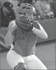  ?? NWA Democrat-Gazette/MIKE CAPSHAW ?? Farmington sophomore catcher Alyssa Reed loads up to throw to second base March 9 during the Lady Cardinals’ game at Bentonvill­e West.