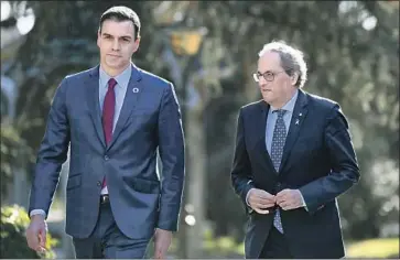 ?? Gabriel Bouys AFP/Getty Images ?? SPANISH Prime Minister Pedro Sánchez, left, and Catalan President Quim Torra meet in Madrid. “This road will be difficult, complex and long,” Sánchez said of the negotiatio­ns on Catalonia’s political future.