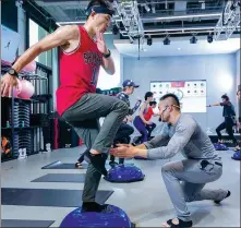  ?? PROVIDED TO CHINA DAILY ?? A trainer teaches at a gym in Beijing in October.