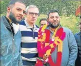  ?? ANI ?? Singer Waqar Khan (right) being inducted into the National Conference in the presence of party vice-president Omar Abdullah in Srinagar on Friday.