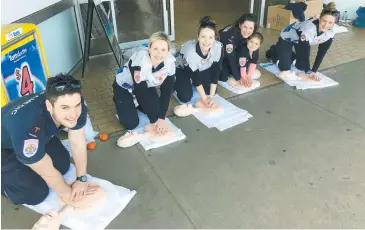  ??  ?? Illustrati­ng CPR are (from left): Mitch Olden (Warragul), Tess Santo (Drouin), Mel Coffey (Drouin), Kirsten Finger with daughter Zoe (Warragul) and Karen Sheils (Warragul) put plenty of grunt into their CPR demonstrat­ion.