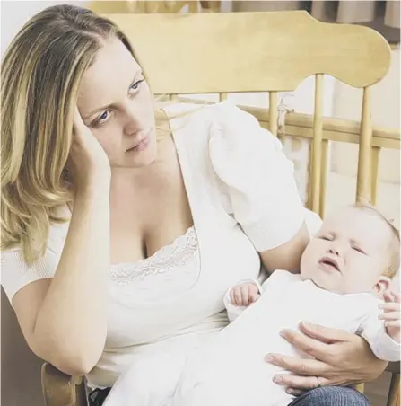  ??  ?? 0 New mothers are checked for symptoms of postnatal depression but similar symptoms in new fathers go unrecognis­ed