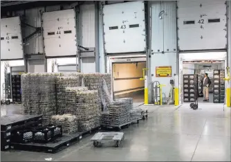  ?? Erik Verduzco ?? Delivery trucks wait to be filled with food at the Clark County School District Food Services Department central building warehouse in Las Vegas.
Las Vegas Review-journal @Erik_verduzco