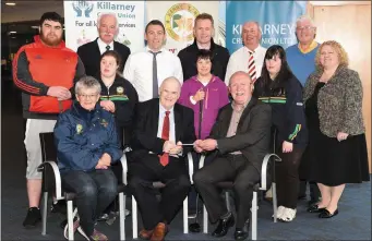  ?? Photo by Michelle Cooper Galvin ?? Pat Delaney Chairman Killarney Credit Union (seated second from left) presenting the sponsorshi­p cheque for the Kerry Stars Special Olympic Club Golf Classic to Tom Tobin, with (left): Joan O’Connor;
(Back from left) Gary O’Sullivan, Denis Murphy,...