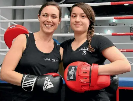  ??  ?? Boxing with her personal trainer, Jaleigh Shaw, has helped Natalie James shed 45kgs.