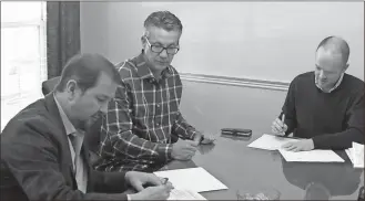  ??  ?? Marco Gomez Roquero, Ray Caron and City Attorney Carey Pilgrim sat together and signed agreements helping Norax expand in Cedartown.Aimee Madden /City of Cedartown