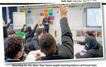  ??  ?? Reaching for the skies: Year Seven pupils learning history at Forest Gate