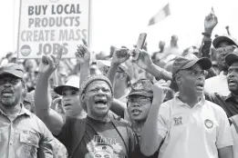  ?? AP ?? Labour unionists march on the streets to protest economic hardship in Lagos, Nigeria, on Tuesday, February 27, 2024. Nigerian government workers began a new nationwide strike Tuesday, that threatens to shut down key services across the country.