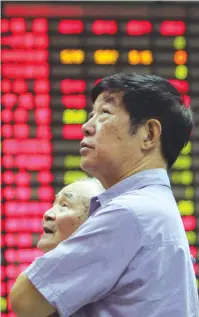  ?? (Aly Song/Reuters) ?? WHILE INVESTORS understand that, if they are investing for the long-term, there are going to be market drops, emotionall­y, no one likes losing money and a certain sense of anxiety may take over.