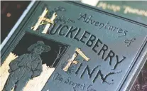  ??  ?? Mark Twain’s Huckleberr­y Finn has long been a target of book bans ever since its first publicatio­n in 1885. Was his portrayal of Jim humiliatin­g?