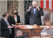  ?? AP PHOTO/J. SCOTT APPLEWHITE ?? Senate Parliament­arian Elizabeth MacDonough, left, works beside Vice President Mike Pence during the certificat­ion of Electoral College ballots in the presidenti­al election, in the House chamber at the Capitol in Washington on Jan. 6.