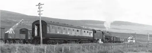  ?? Roy Hobbs/Transport Treasury ?? Having collected the restaurant car, the ‘Black Five’ heads off toward Achnasheen East box and reversal. The coach is a restaurant second designed by William Stanier and built at Derby in 1933. It is a Diagram 1901 (Lot 733) vehicle, very similar to Diagram 1861 (Lot 685) but with deeper window ventilator­s. They were mounted on six-wheel bogies, were built as restaurant thirds and had five bays and 30 seats, but no luggage or lavatory accommodat­ion. Ten of each type were built, Nos 101-110 (Lot 685) and 111-120 (Lot 733), but 13 were used as wartime ambulances and never returned to everyday service. Of the seven remaining, No 103 was withdrawn in 1953, leaving Nos 101, 102 and 111-114. Four of the seven would be gone by the end of 1962, and the final two, Nos SC113 and SC114, at the end of 1963.