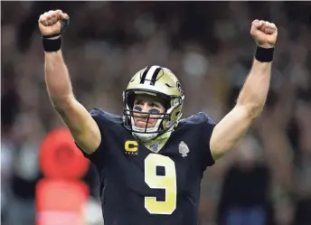  ?? GETTY IMAGES ?? Saints quarterbac­k Drew Brees celebrates his 540th career touchdown pass, the most in league history, passing Peyton Manning on the all-time list.