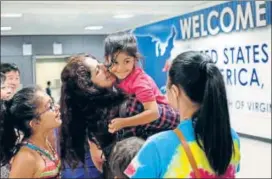  ?? REUTERS ?? Travellers from a Muslimmajo­rity nation arrive at the Washington Dulles Internatio­nal Airport in Dulles, Virginia, after a Hawaii court, in a ruling, weakened Donald Trump’s travel ban.