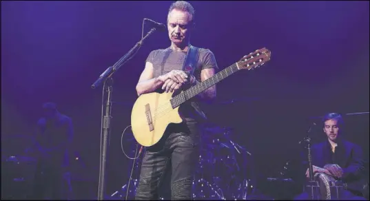  ?? DAVID WOLFF PATRICK/UNIVERSAL MUSIC FRANCE VIA AP ?? British musician Sting observes a minute of silence Saturday in memory of the victims of the Nov. 13, 2015, Paris attacks before performing on stage at the Bataclan concert hall in Paris. The concert marked the reopening of the concert hall one year after militants turned it into a bloodbath and killed 90 people.