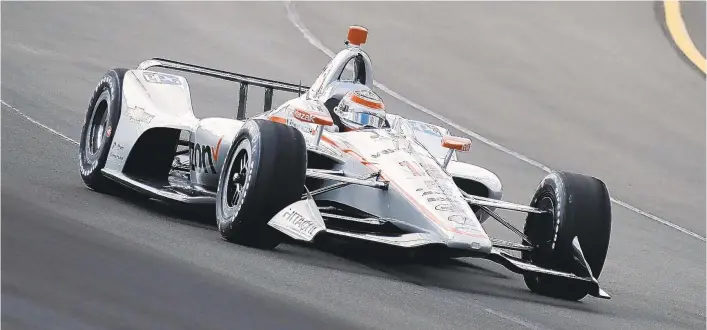  ?? MATT SLOCUM/AP ?? Will Power, driving Sunday in the IndyCar Series race, won for the third time in four years at Pocono Raceway. A thundersto­rm shortened the scheduled 200-lap race to just 128.