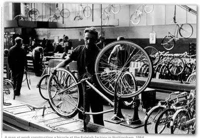  ??  ?? A man at work constructi­ng a bicycle at the Raleigh factory in Nottingham, 1964