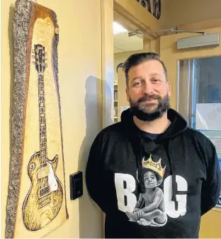  ?? GARTH HURLEY/THE GUARDIAN ?? Jason Johnston’s pyrography exhibition at the Cornwall Library Art Gallery includes his interpreta­tion of a guitar used by Led Zeppelin’s Jimmy Page.