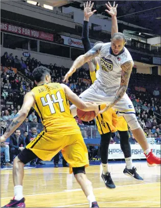 ?? KEITH GOSSE/THE TELEGRAM ?? Grandy Glaze (55) of the St. John’s Edge looks to wrest the ball from Ryan Anderson of the London Lightning on the way down during their NBL Canada game at Mile One Centre Wednesday night. The Edge won 136-117 to improve to 7-2 in their first season in...
