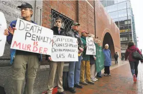  ?? John Tlumacki / Boston Globe 2015 ?? Opponents of the death sentence gather outside the courthouse in 2015 during the penalty phase of the trial of Boston Marathon bomber Dzhokhar Tsarnaev.