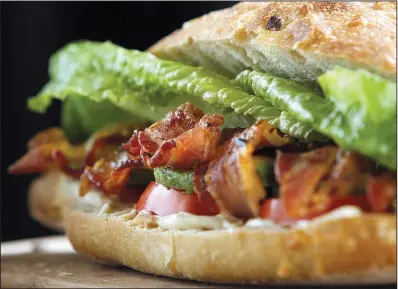  ?? Arkansas Democrat- Gazette fi le photo ?? Caramelize­d bacon and slices of avocado dress up almost- classic BLT.