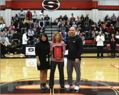  ??  ?? Sonoravill­e head coach Stephanie Caudell (center) celebrates her 200th win, which was earned last season against Adairsvill­e. Also pictured is Sonoravill­e High principal Jennifer Hayes and athletic director Brent Mashburn.