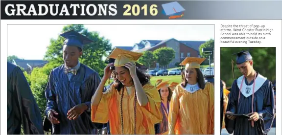  ??  ?? West Chester Rustin High School seniors make the long trek from the school and across the scenic bridge to the football stadium for commenceme­nt on Tuesday.