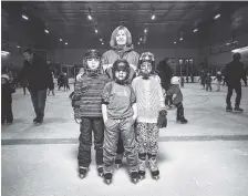  ?? DAMON WINTER/THE NEW YORK TIMES PHOTOS ?? Carole Atkins, rear, with the al-Hajj children, from left, Majed, Moutayam and Zahiya, attend an open skating session at East York Memorial Arena in Toronto earlier this month.