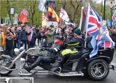  ??  ?? Support: Biker at Saturday’s rally in London for Troubles veterans. Left, firemen at 1974 Birmingham pub bombings