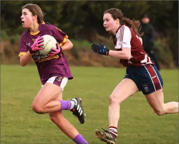  ??  ?? Wexford’s Sophie Boxwell racing away from Ruth Martin of Westmeath.