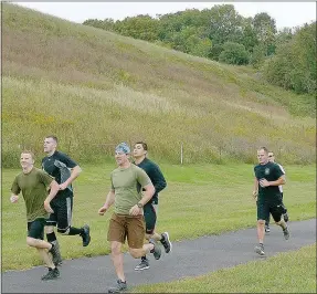  ?? Keith Bryant/The Weekly Vista ?? The first physical test police department applicants go through is a one-and-a-half mile run around the Loch Lomond ball field.