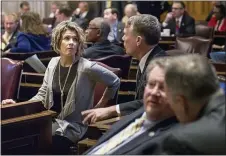  ?? ERIK SCHELZIG — THE ASSOCIATED PRESS FILE ?? In this Thursday, Feb. 16, 2017 file photo, Rep. Terri Lynn Weaver, R-Lancaster, left, and Rep. John Mark Windle, D-Livingston, confer during a House floor session in Nashville, Tenn. Tennessee state Rep. Terri Lynn Weaver on Wednesday night said it had been an “epic and historic day.” The Republican lawmaker told The Tennessean that she was “in the thick of it” but hadn’t seen any violence.